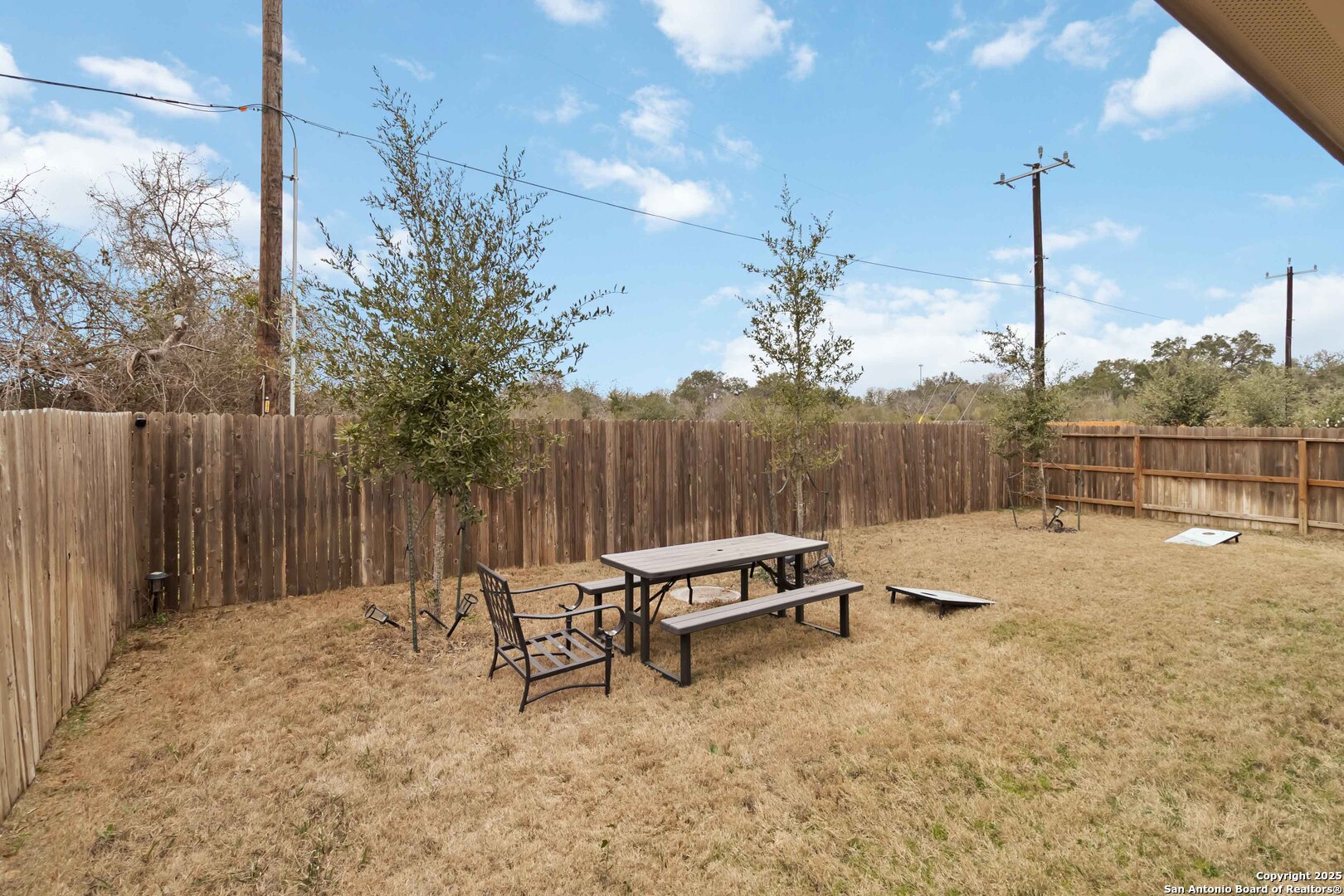 3335 Iron Canyon Bulverde, TX 78163 - Photo 15 of 17 a backyard of a house with table and chairs