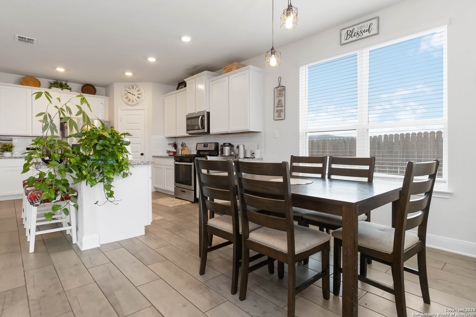 3335 Iron Canyon Bulverde, TX 78163 - Photo 8 of 17 a dining room with furniture and potted plants