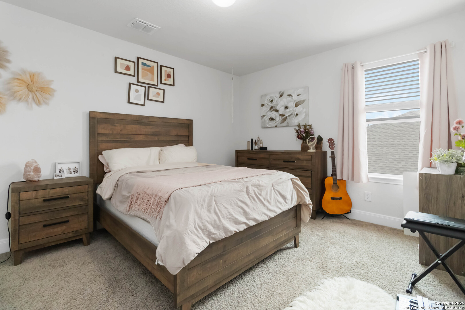 3335 Iron Canyon Bulverde, TX 78163 - Photo 10 of 17 a bed sitting in a bedroom next to a window