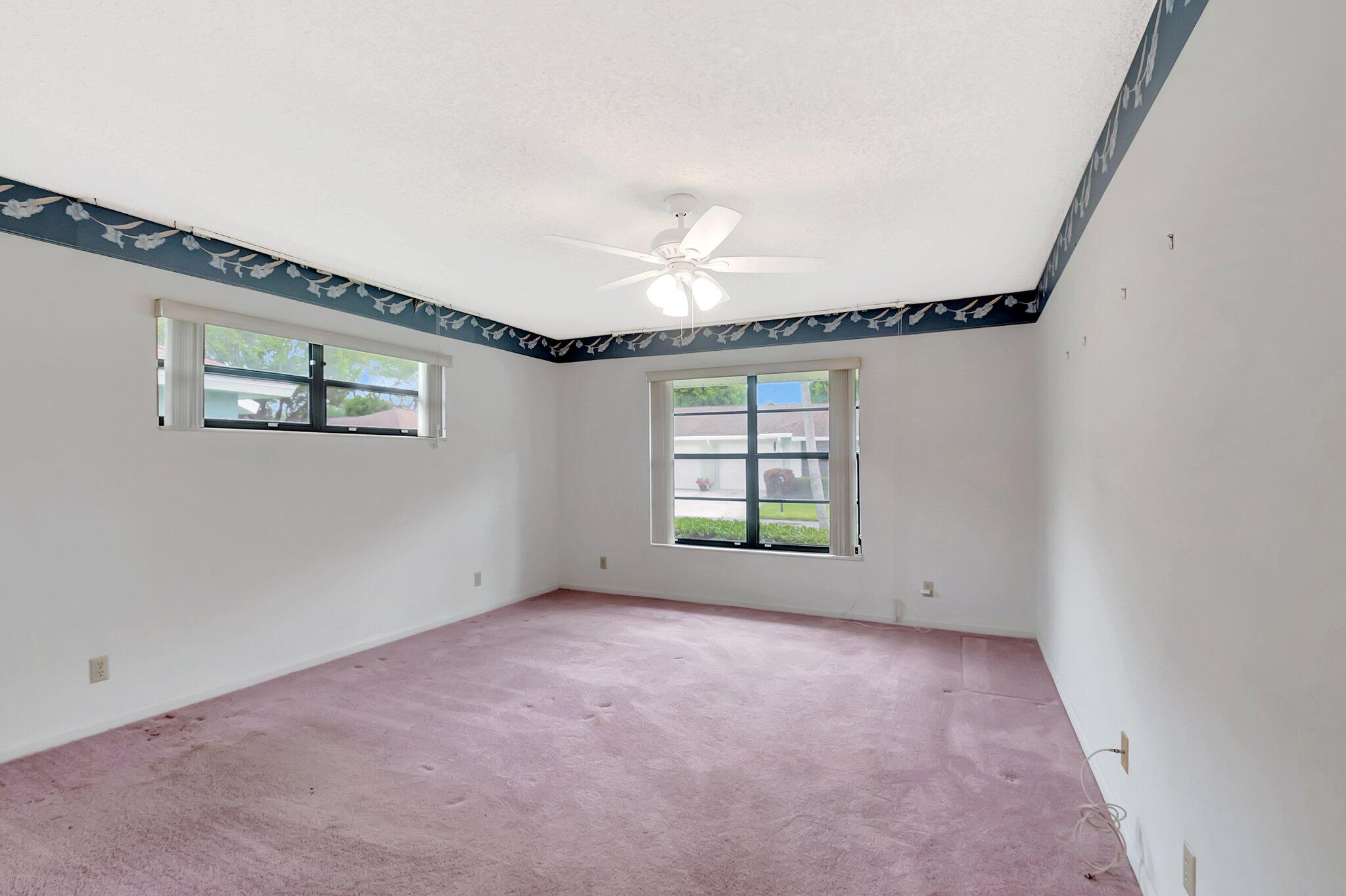 9765 Pecan Tree Drive, Unit B Boynton Beach, FL 33436 - Photo 21 of 35 Primary Bedroom