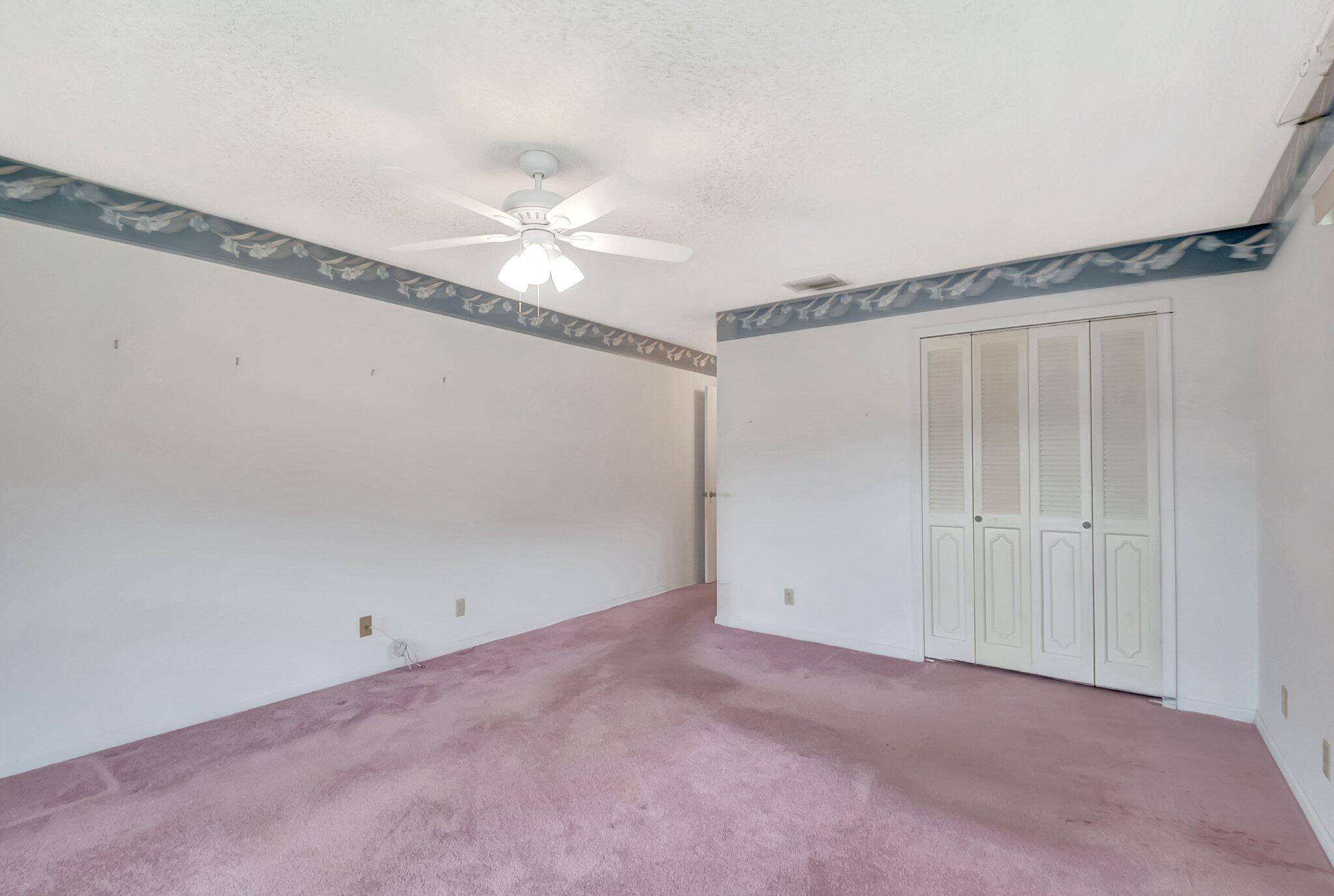 9765 Pecan Tree Drive, Unit B Boynton Beach, FL 33436 - Photo 22 of 35 Primary Bedroom