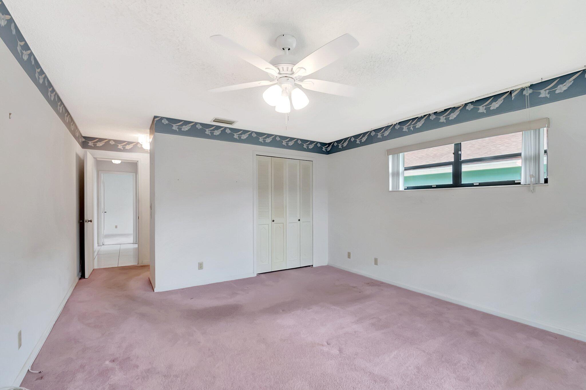 9765 Pecan Tree Drive, Unit B Boynton Beach, FL 33436 - Photo 23 of 35 Primary Bedroom