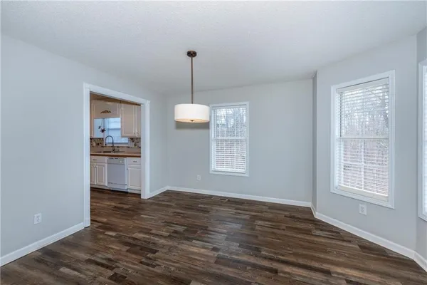 a view of a kitchen with window wooden floor and a sink