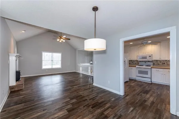 a view of a kitchen with a sink and dishwasher wooden floor