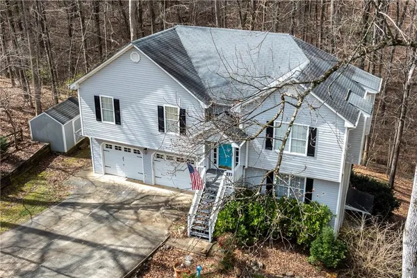 a aerial view of a house with a yard