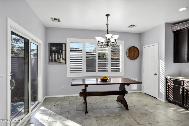 a view of a livingroom with furniture and chandelier