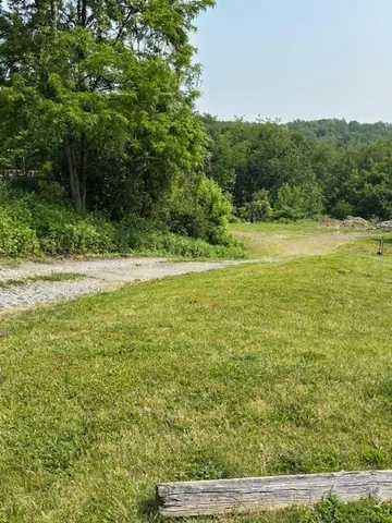 a view of a field with an outdoor space