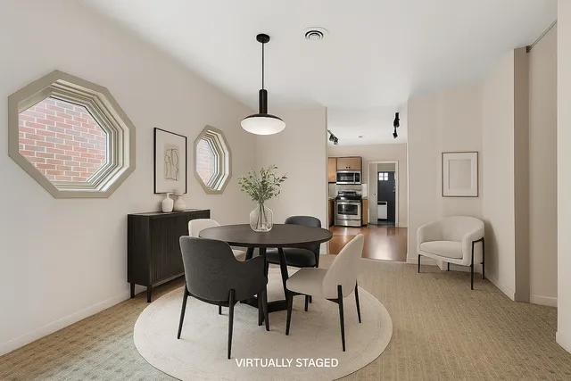 a view of a livingroom with furniture and a table