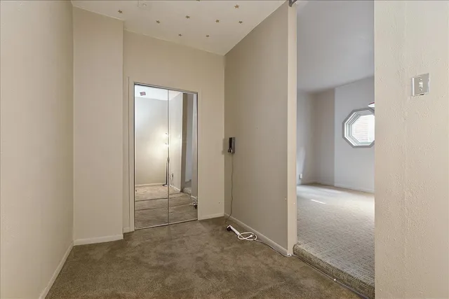 a kitchen with stainless steel appliances wooden floor sink and refrigerator