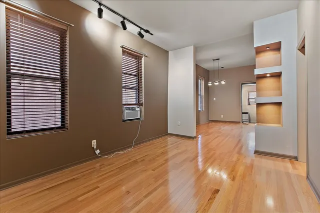 a view of livingroom with hardwood floor and a ceiling fan