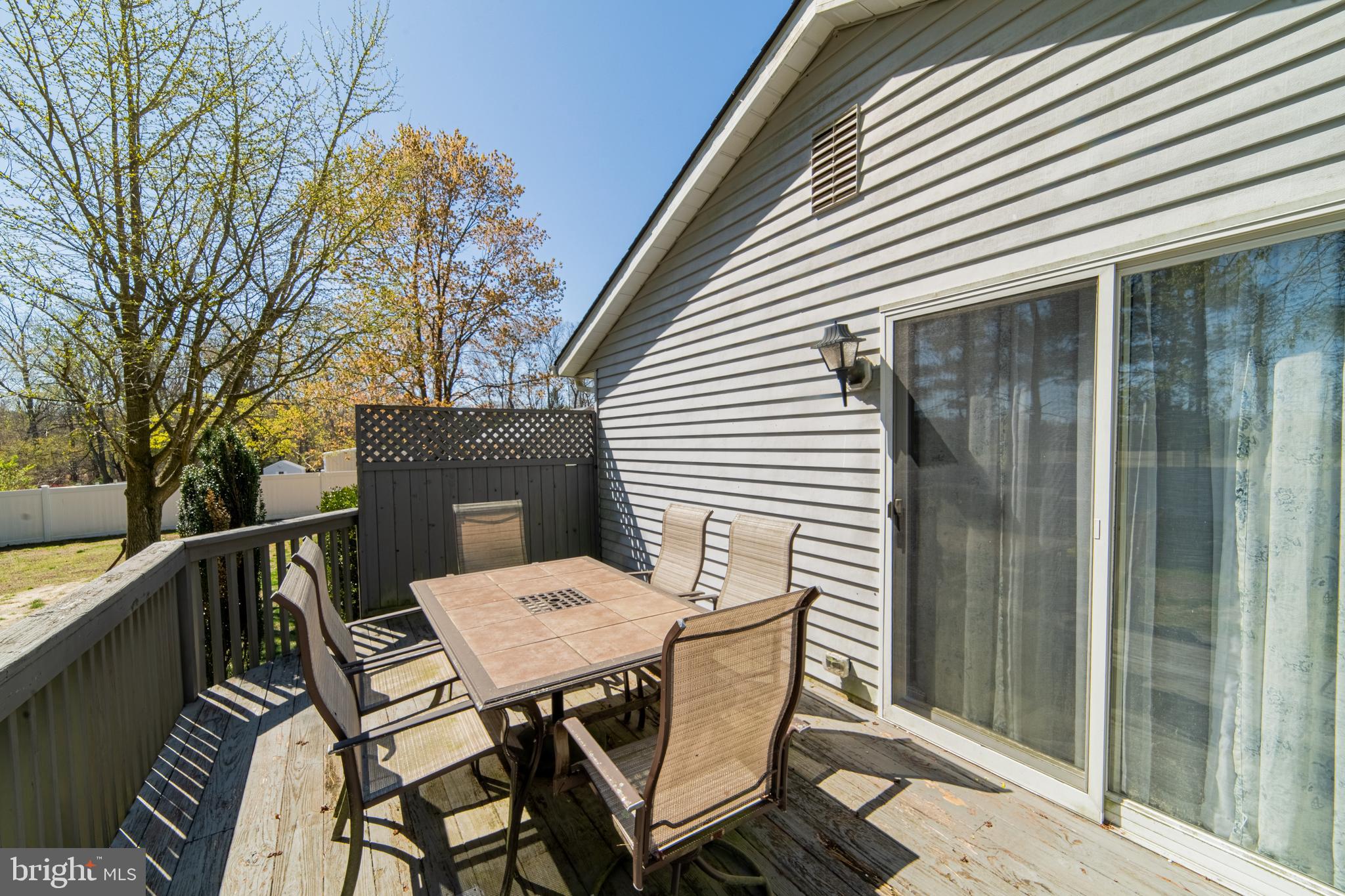 49 Husted Station Road Bridgeton, NJ 08302 - Photo 11 of 33 a backyard of a house with table and chairs