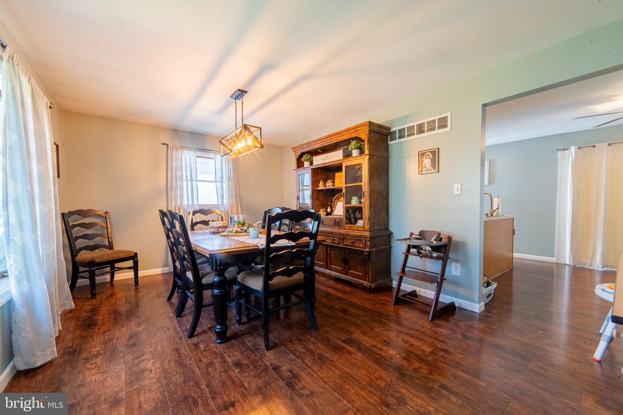 49 Husted Station Road Bridgeton, NJ 08302 - Photo 13 of 33 a view of a dining room with furniture and wooden floor