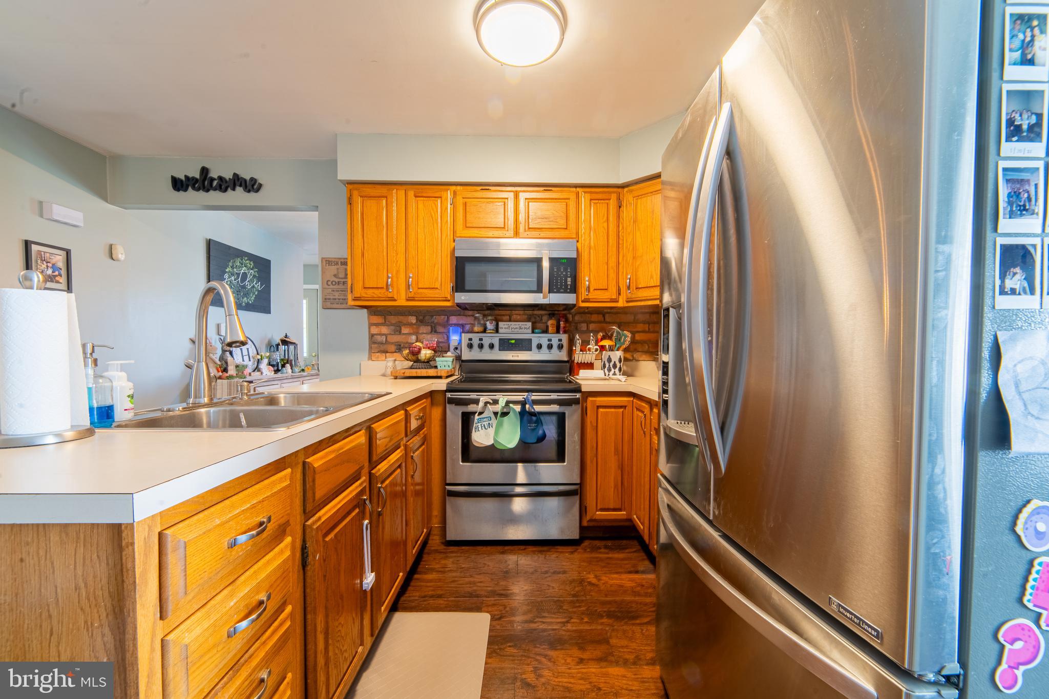 49 Husted Station Road Bridgeton, NJ 08302 - Photo 16 of 33 a kitchen with stainless steel appliances granite countertop a refrigerator and a sink