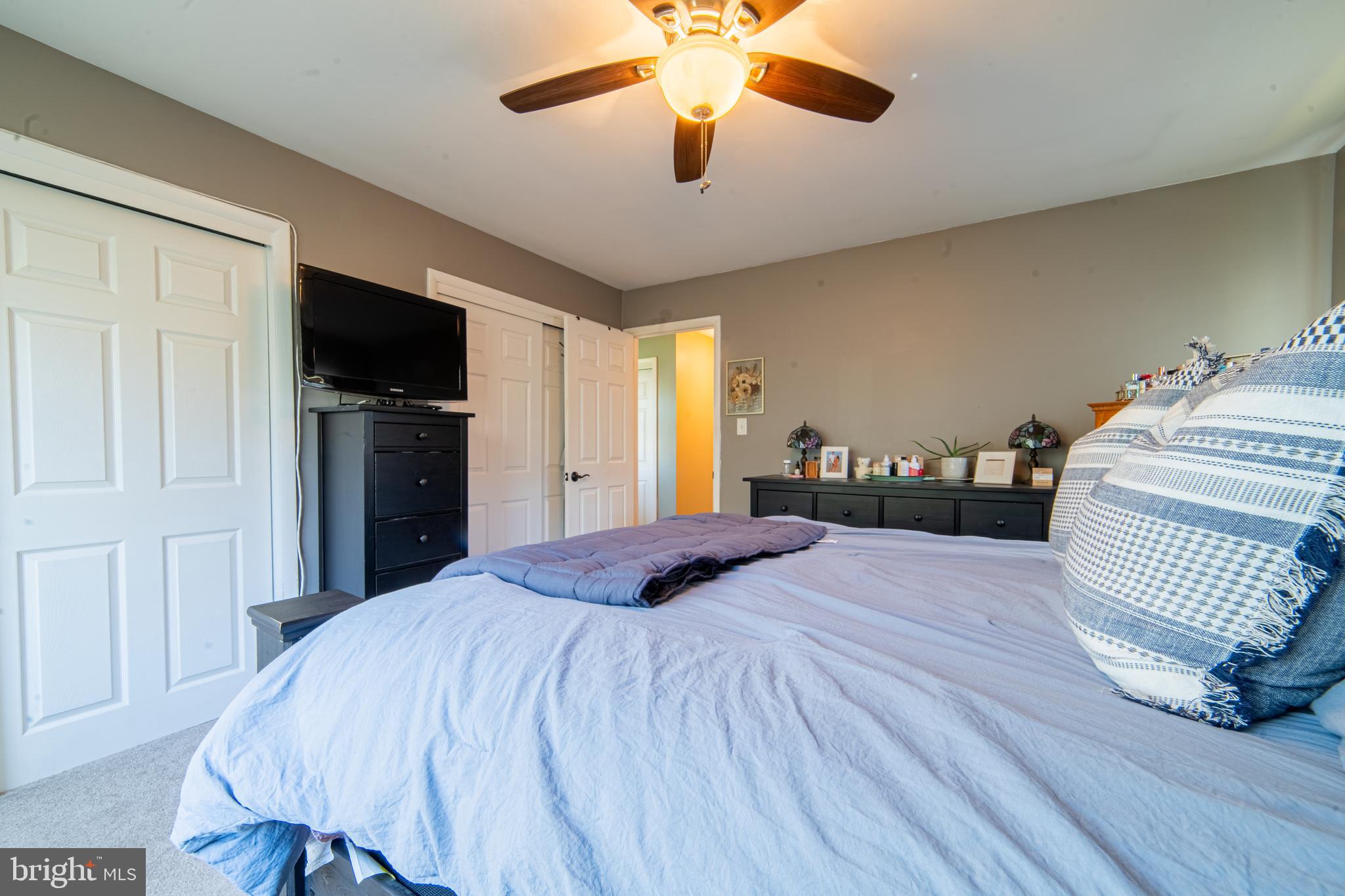 49 Husted Station Road Bridgeton, NJ 08302 - Photo 25 of 33 a bedroom with a bed and a flat screen tv