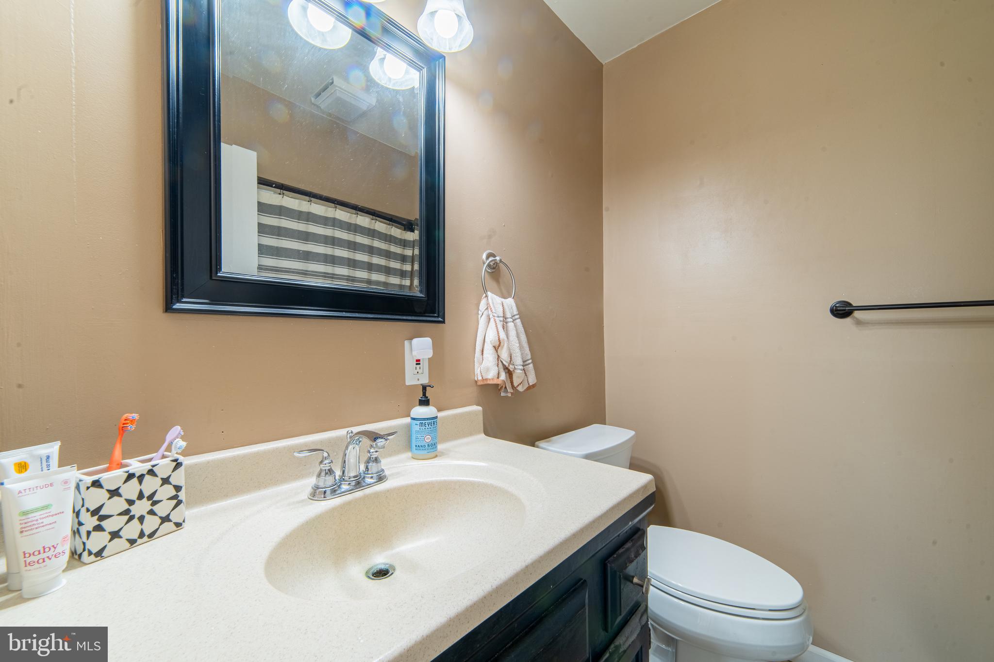 49 Husted Station Road Bridgeton, NJ 08302 - Photo 26 of 33 a bathroom with a sink vanity mirror and toilet