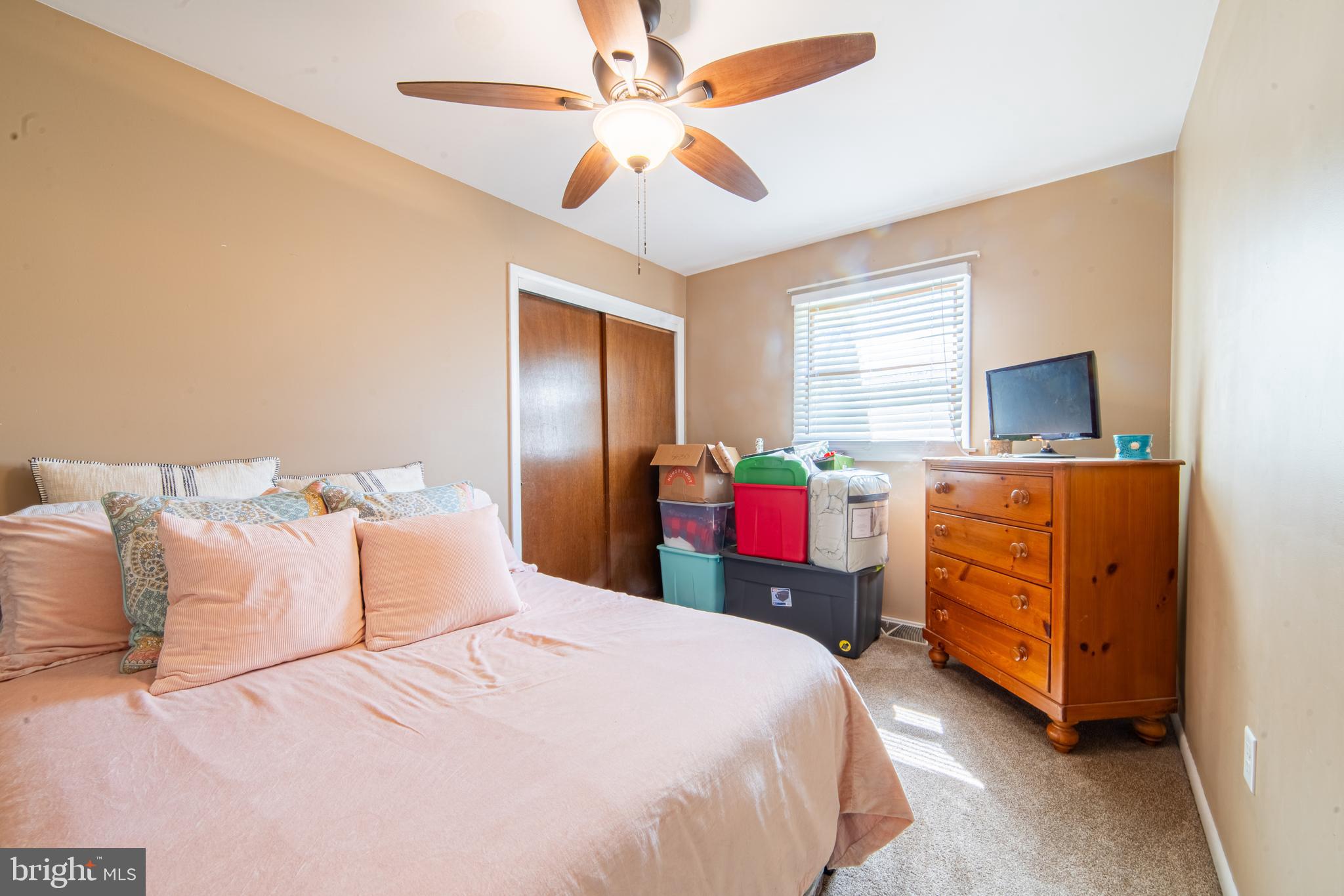 49 Husted Station Road Bridgeton, NJ 08302 - Photo 28 of 33 a bedroom with a bed and a chandelier