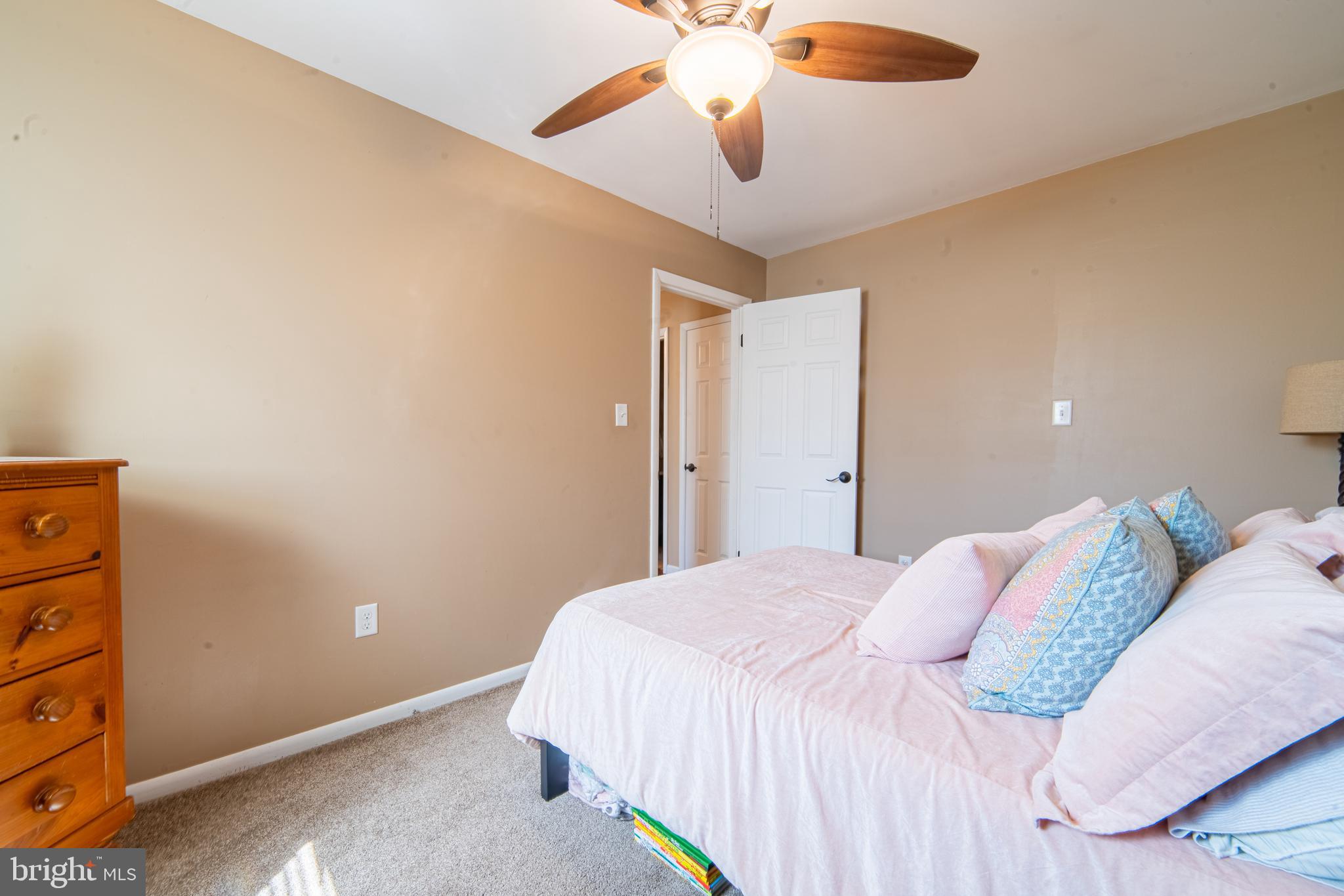49 Husted Station Road Bridgeton, NJ 08302 - Photo 29 of 33 a bedroom with a bed and a chandelier