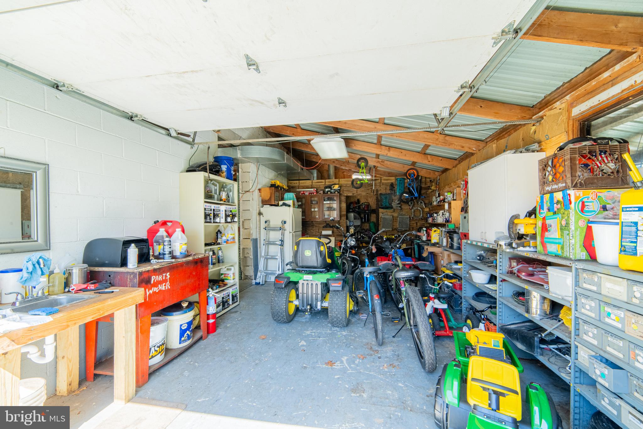 49 Husted Station Road Bridgeton, NJ 08302 - Photo 30 of 33 a utility room with lots of toys and plants