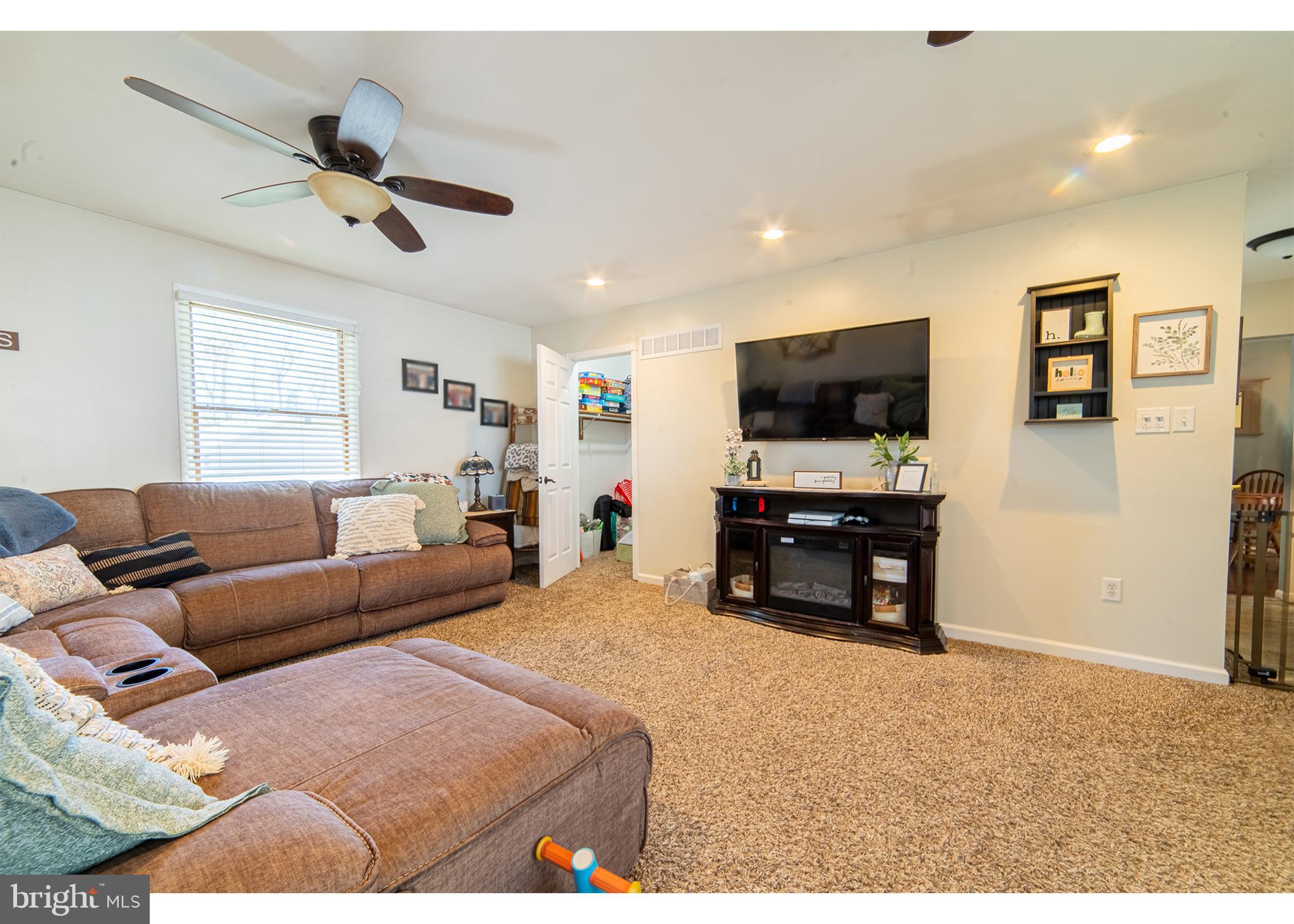 49 Husted Station Road Bridgeton, NJ 08302 - Photo 33 of 33 a living room with furniture and a flat screen tv