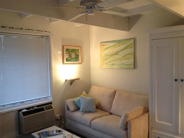 169 Shore Road, Unit 19 Truro, MA 02666 - Photo 5 of 15 a living room with furniture and a window