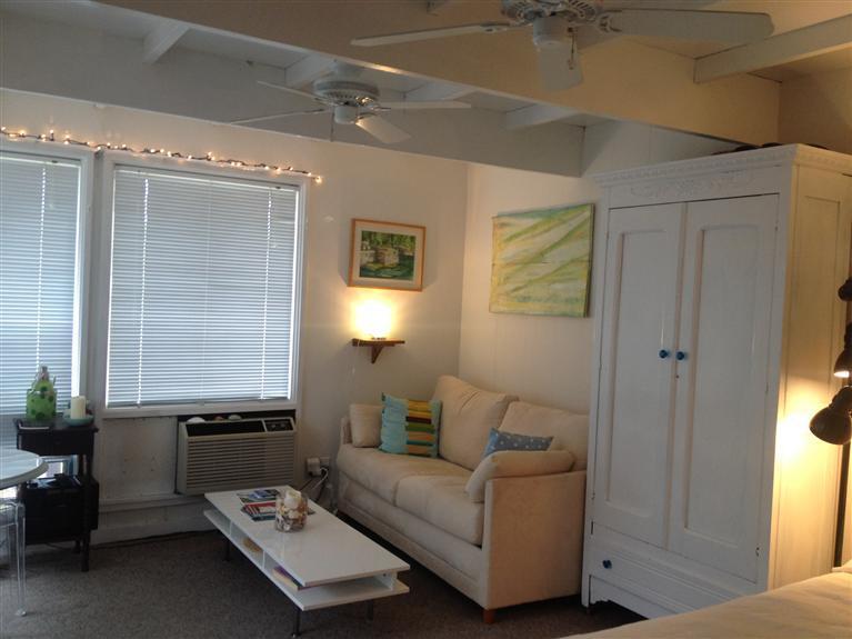 169 Shore Road, Unit 19 Truro, MA 02666 - Photo 10 of 15 a living room with furniture and a window