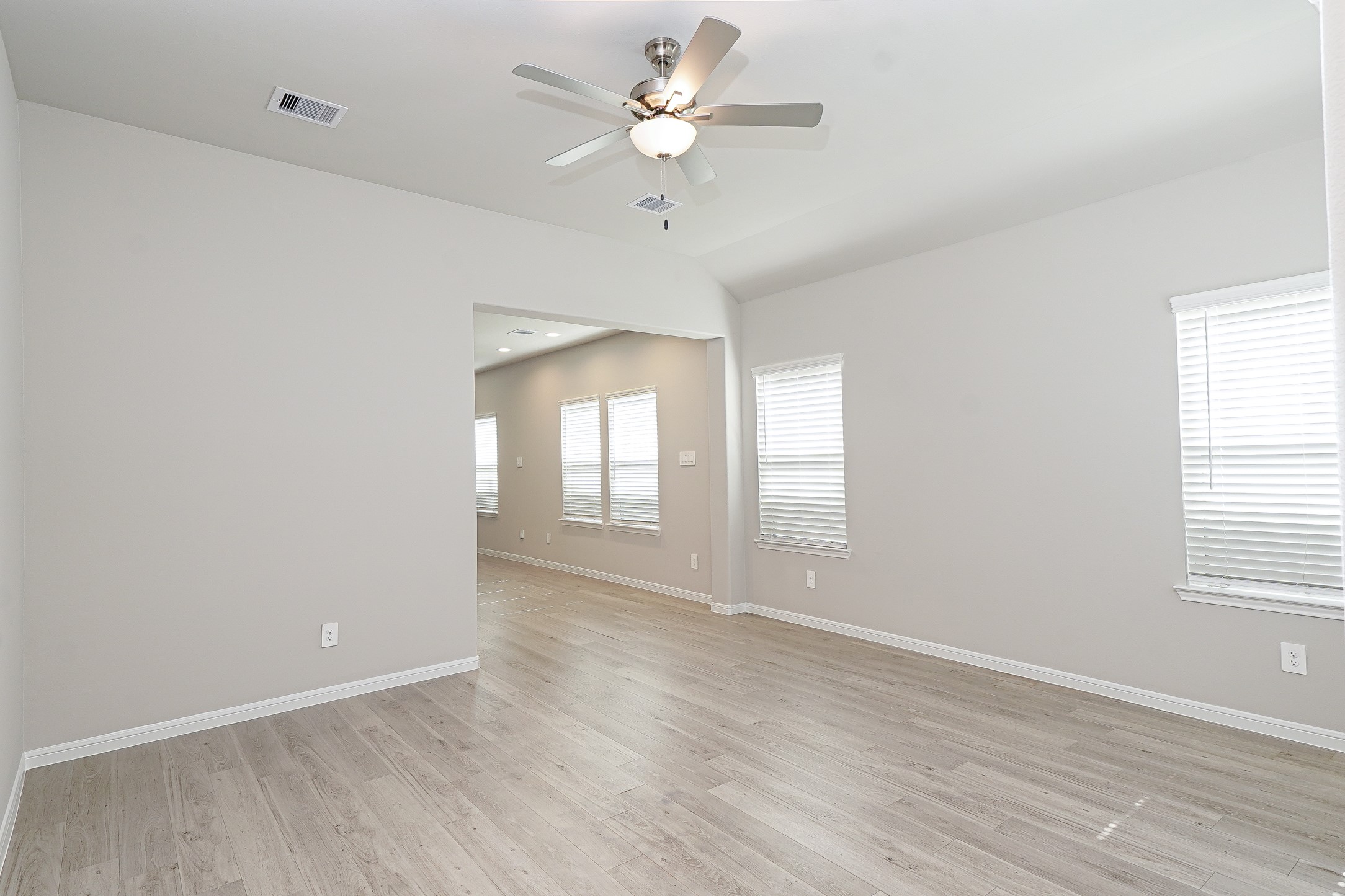 9254 Sea Gdn Street Houston, TX 77034 - Photo 14 of 33 wooden floor in an empty room with a window