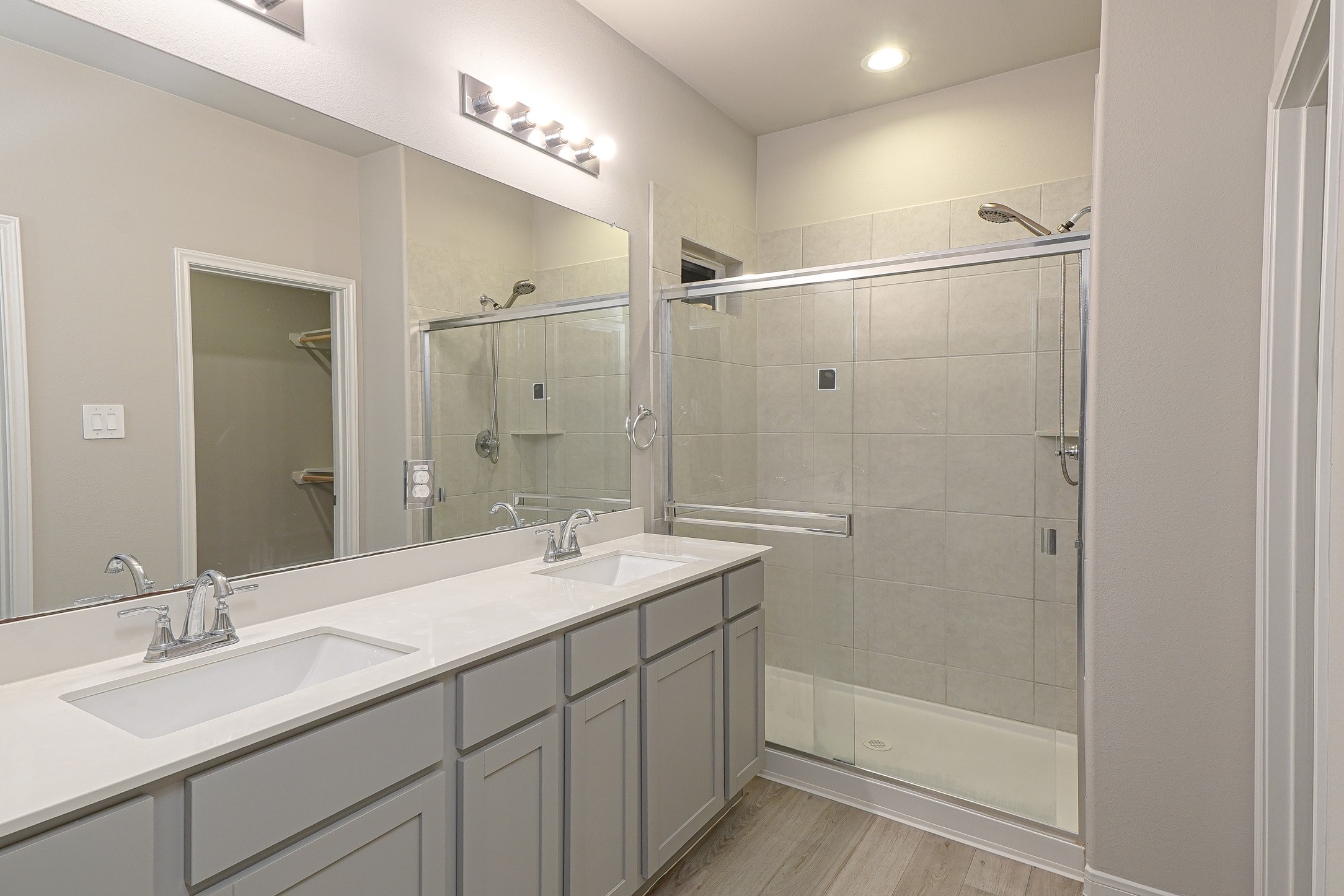 9254 Sea Gdn Street Houston, TX 77034 - Photo 20 of 33 a bathroom with a double vanity sink mirror and shower