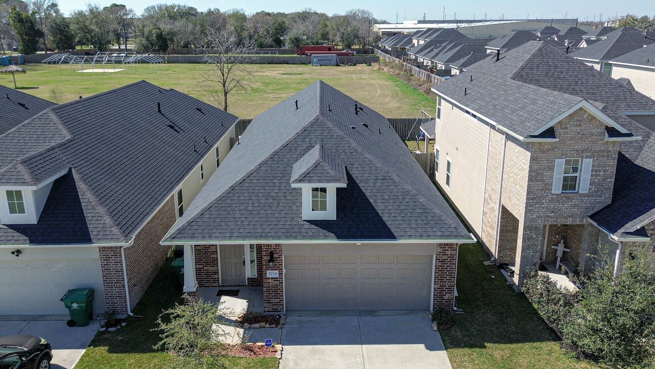 9254 Sea Gdn Street Houston, TX 77034 - Photo 2 of 33 an aerial view of a house with swimming pool