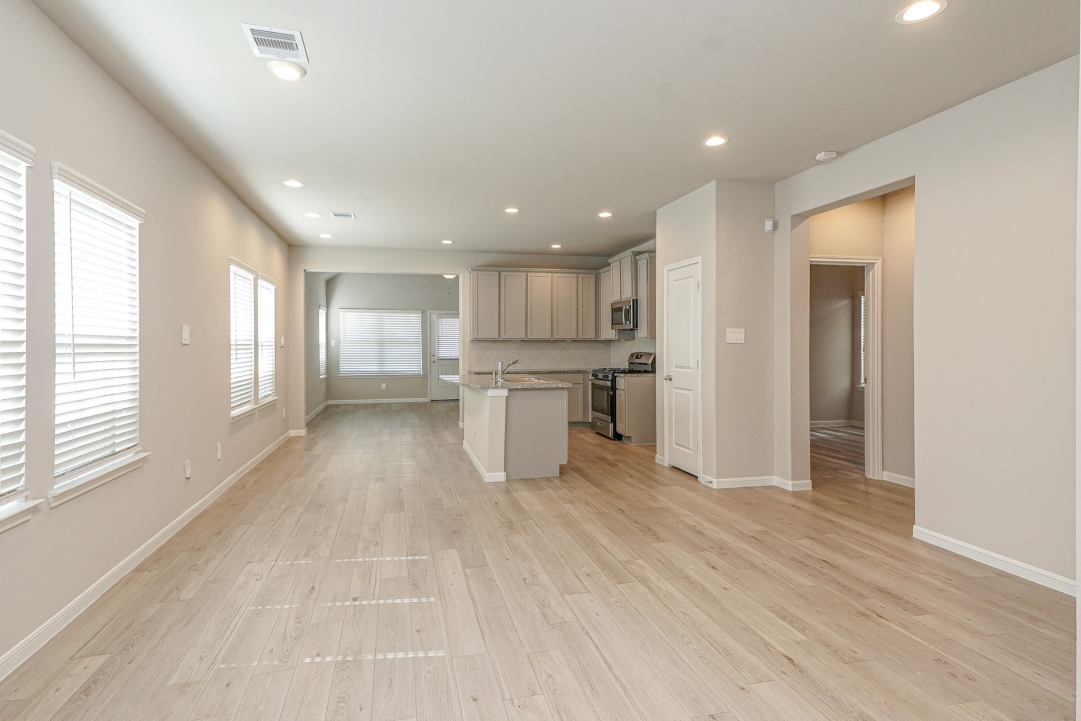 9254 Sea Gdn Street Houston, TX 77034 - Photo 3 of 33 a view of kitchen with wooden floor