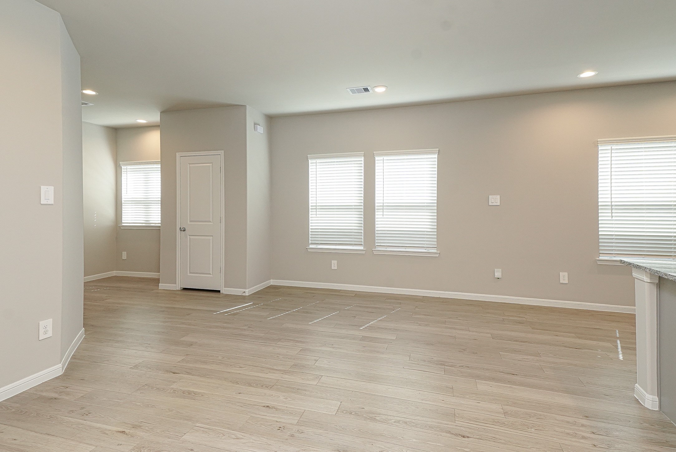 9254 Sea Gdn Street Houston, TX 77034 - Photo 6 of 33 wooden floor in an empty room with a window