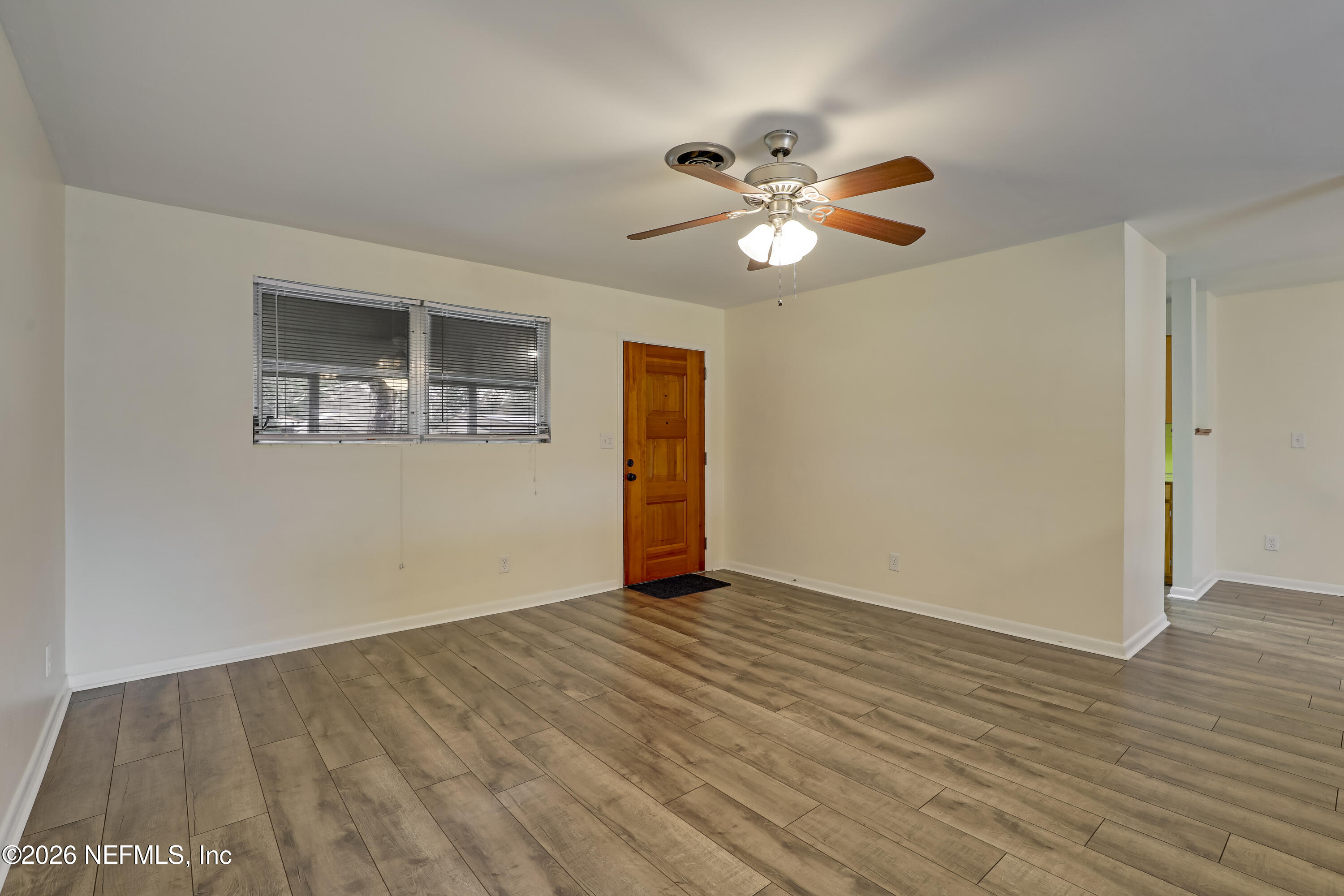 3944 Rodby Drive Jacksonville, FL 32210 - Photo 14 of 40 a view of empty room with wooden floor