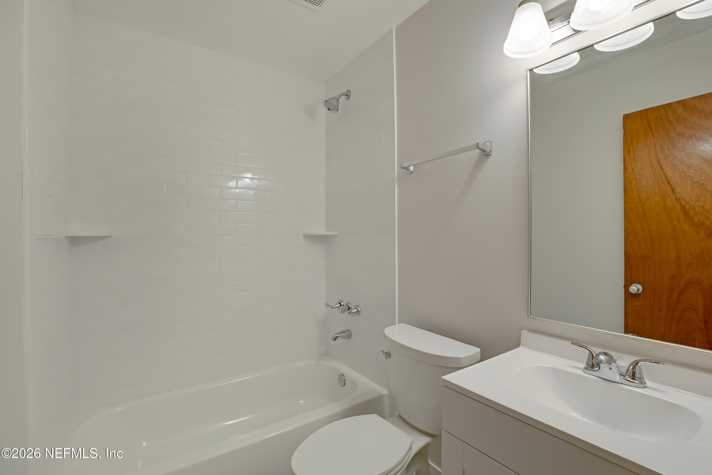 3944 Rodby Drive Jacksonville, FL 32210 - Photo 17 of 40 a bathroom with a sink toilet and shower