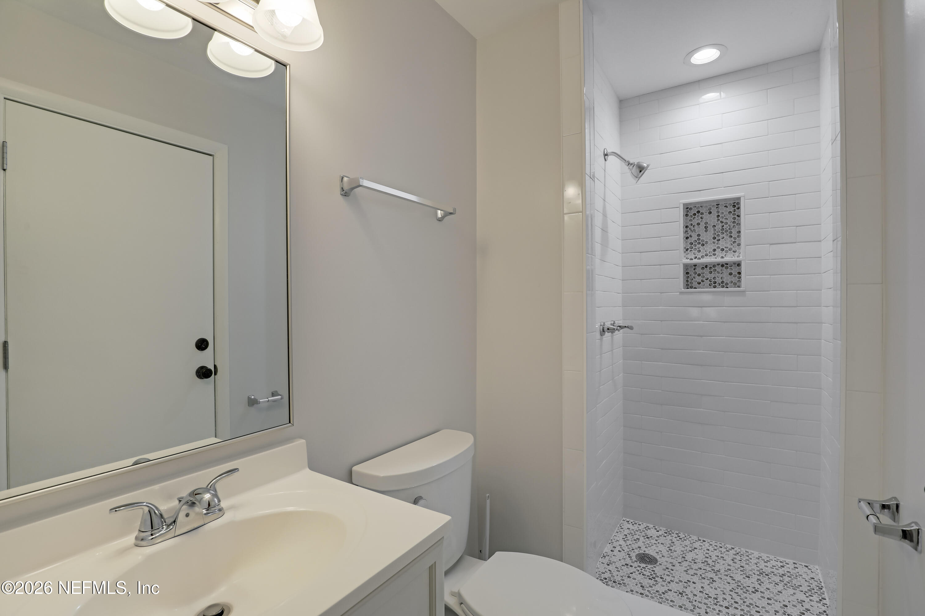 3944 Rodby Drive Jacksonville, FL 32210 - Photo 23 of 40 a bathroom with a sink toilet and shower