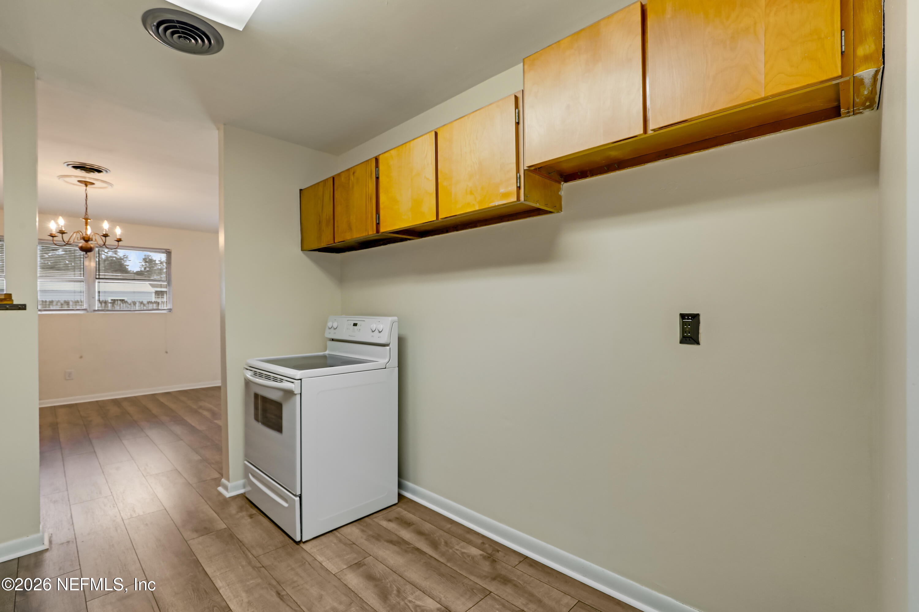 3944 Rodby Drive Jacksonville, FL 32210 - Photo 32 of 40 a view of a kitchen with wooden floor