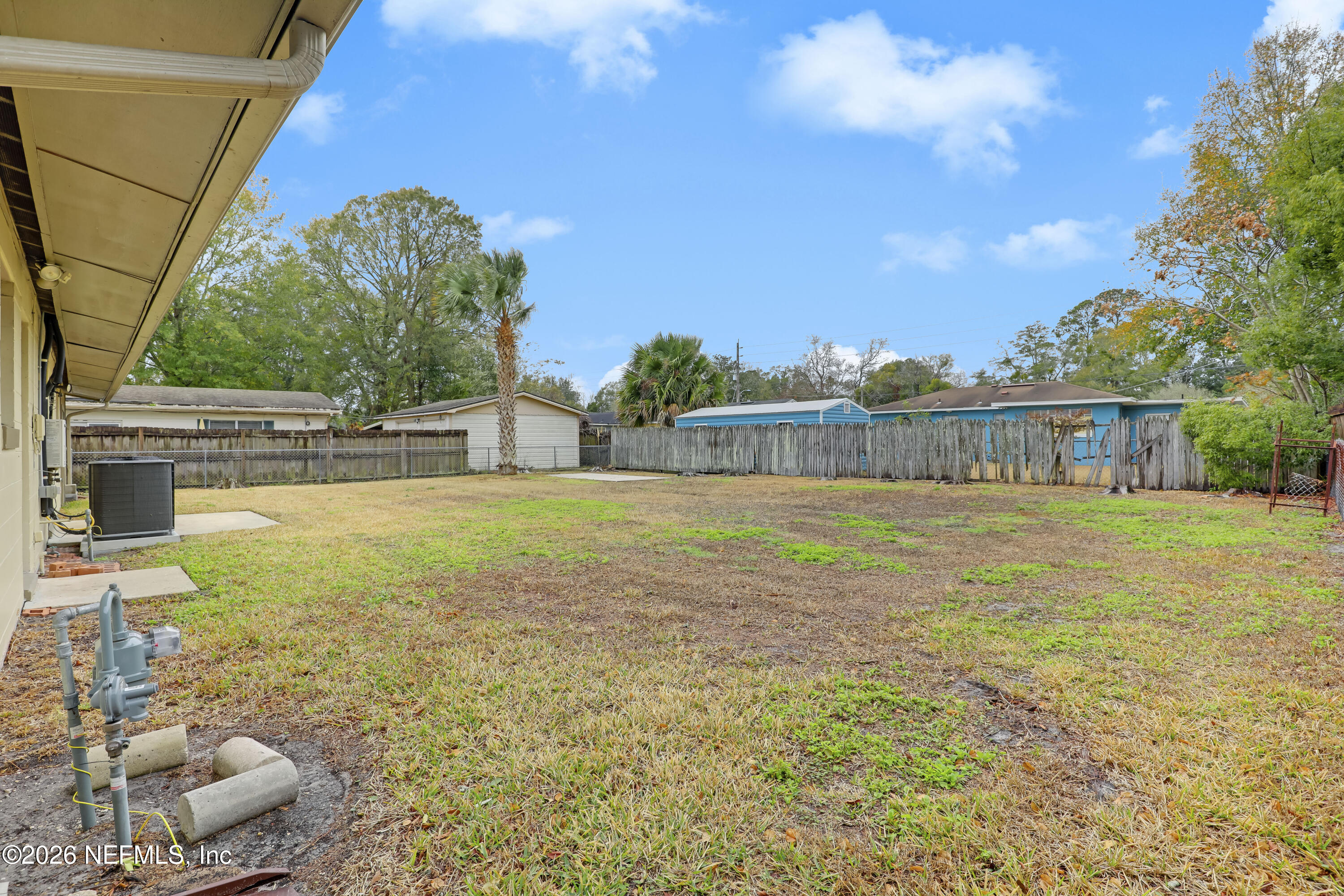 3944 Rodby Drive Jacksonville, FL 32210 - Photo 37 of 40 a view of a house with a yard
