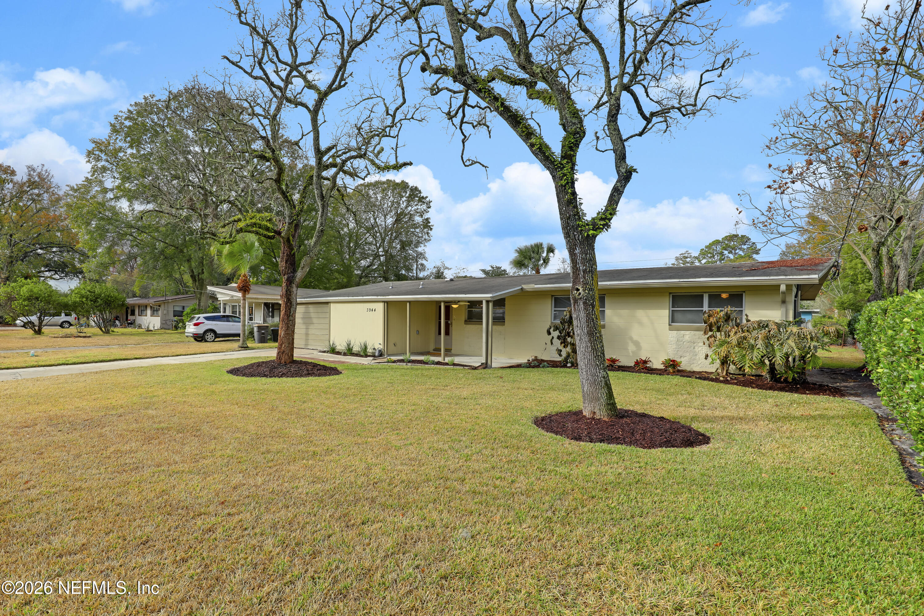 3944 Rodby Drive Jacksonville, FL 32210 - Photo 40 of 40 a view of a house with swimming pool and a trees