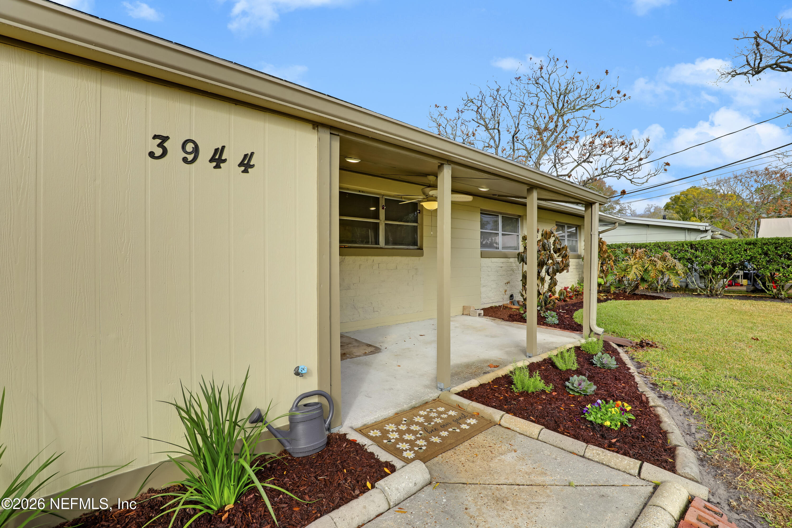 3944 Rodby Drive Jacksonville, FL 32210 - Photo 7 of 40 a front view of a house with garden