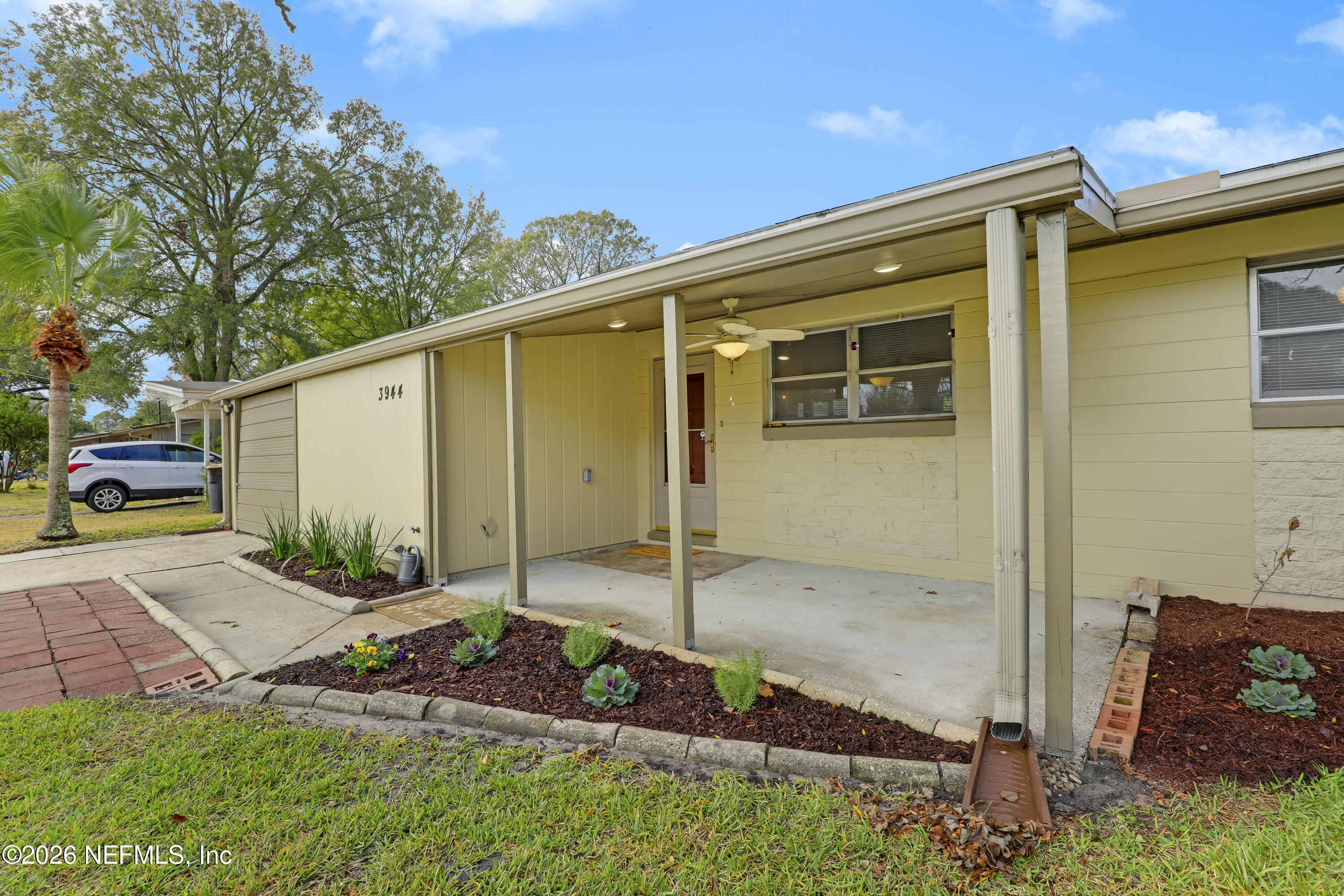 3944 Rodby Drive Jacksonville, FL 32210 - Photo 8 of 40 a backyard of a house with seating space