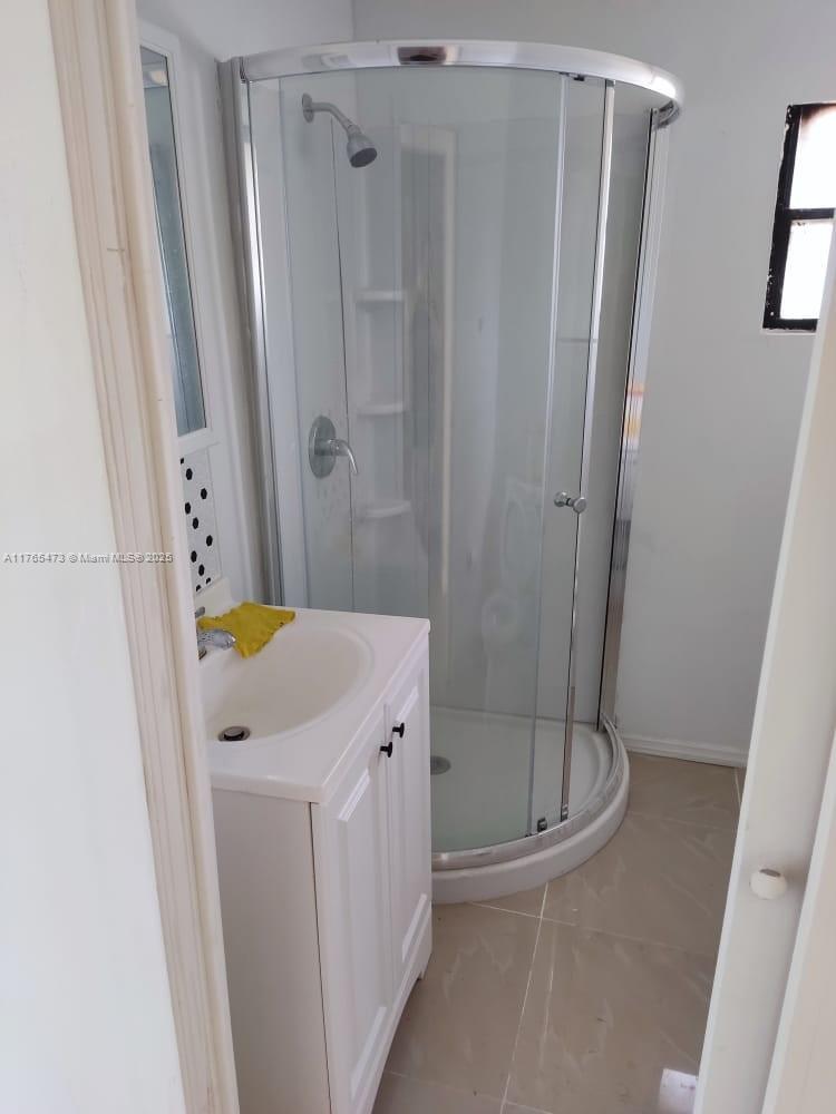 900 Northwest 80th Street Miami, FL 33150 - Photo 7 of 11 a bathroom with a shower and a tub