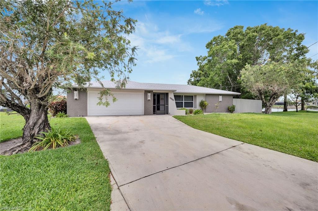3065 50th Lane Southwest Naples, FL 34116 - Photo 2 of 31 front view of house with a yard