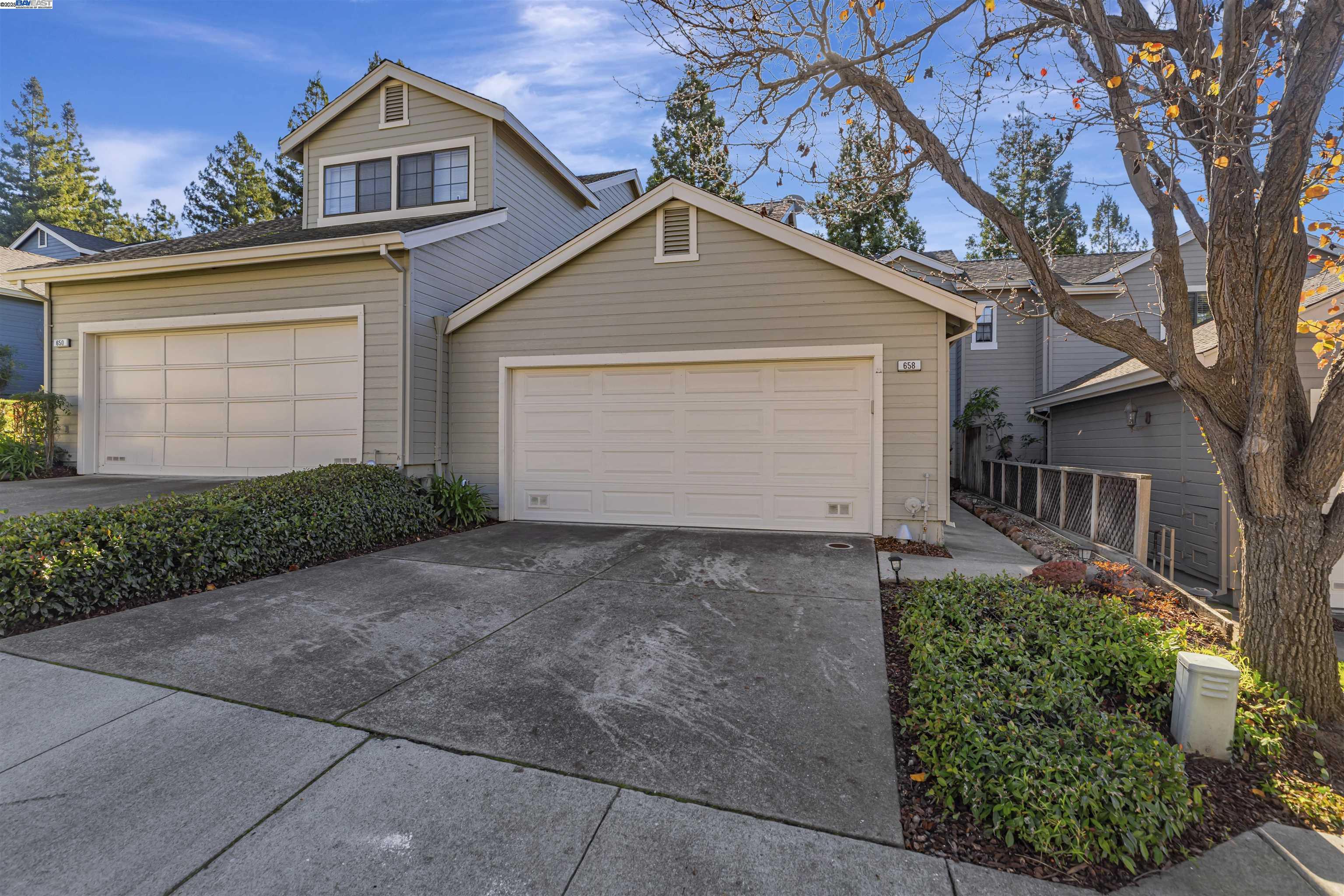 a view of a house with a yard and garage