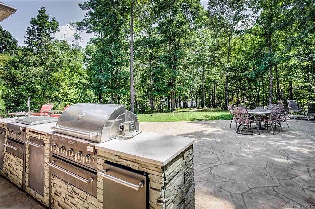 5908 Johnson Road Clover, SC 29710 - Photo 19 of 23 a view of a chairs and table in backyard