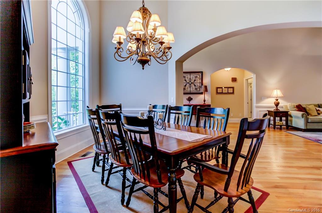 5908 Johnson Road Clover, SC 29710 - Photo 4 of 23 a view of a dining room with furniture a chandelier and wooden floor