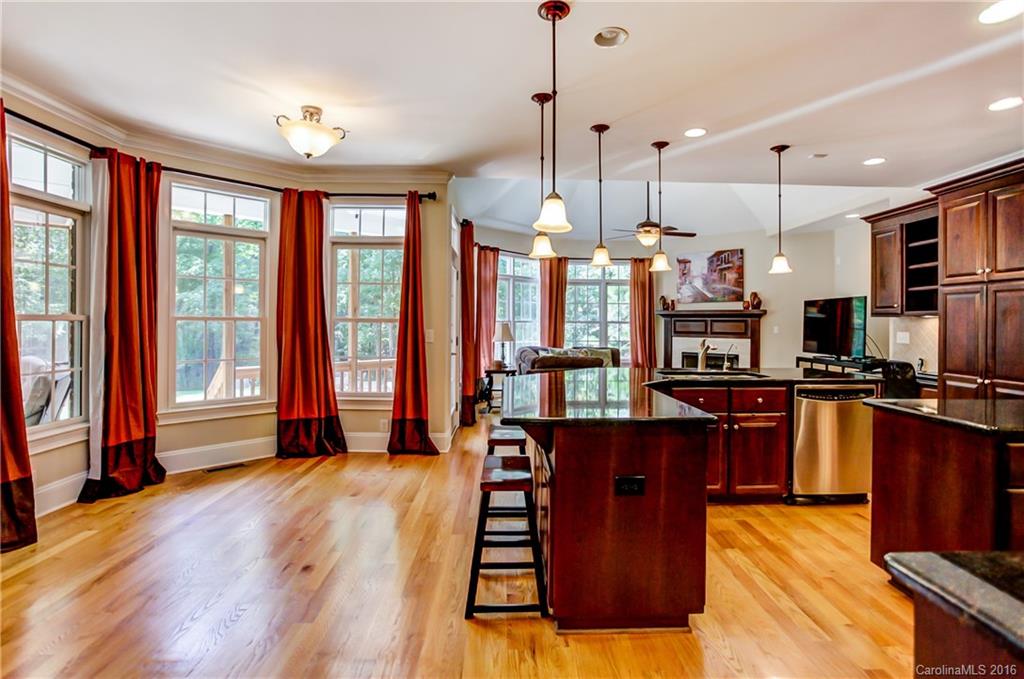 5908 Johnson Road Clover, SC 29710 - Photo 5 of 23 a kitchen with stainless steel appliances granite countertop a refrigerator a sink dishwasher a oven and a dining table with wooden floor