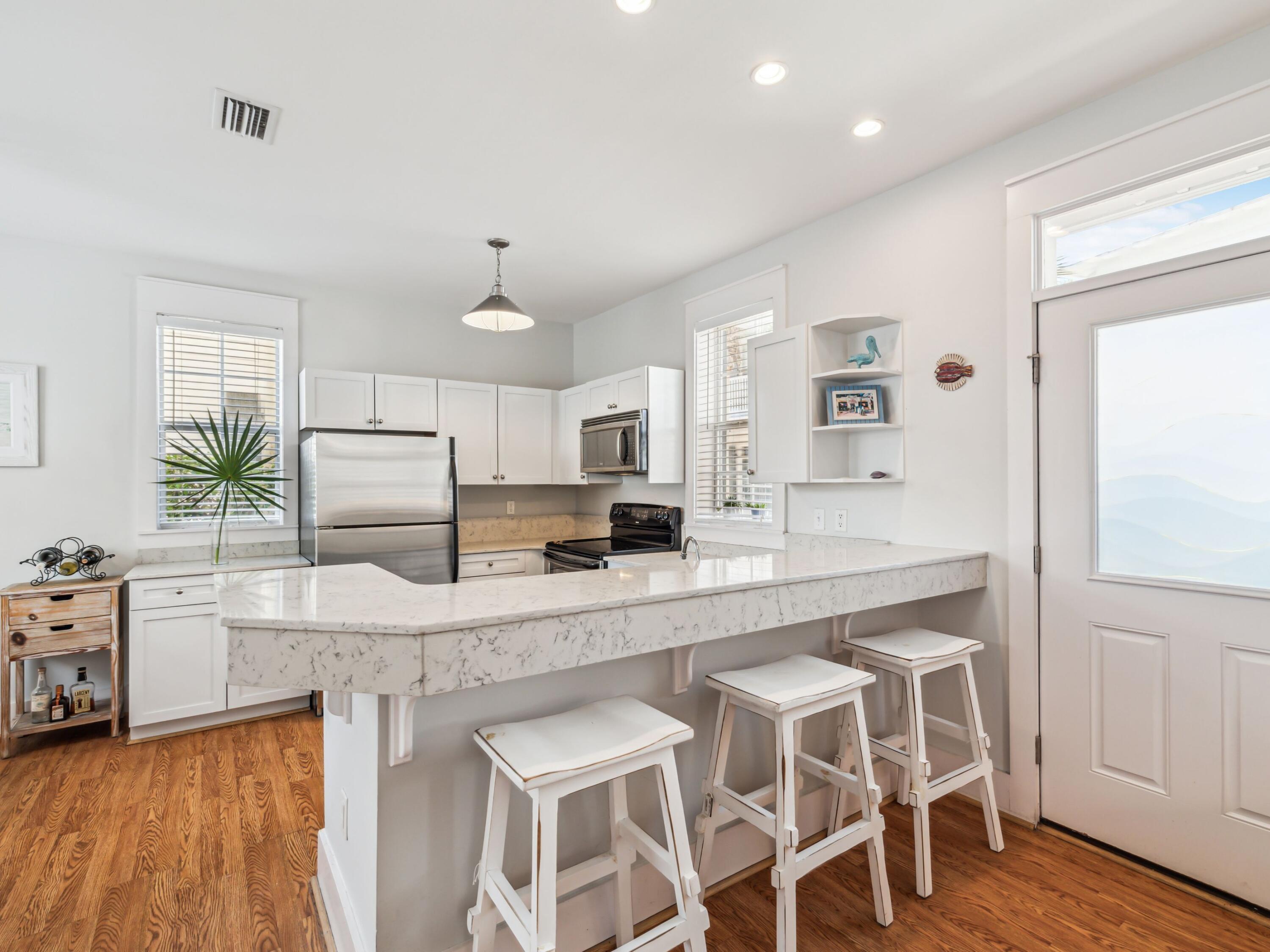 198 Somerset Bridge Road, Unit 103 Santa Rosa Beach, FL 32459 - Photo 12 of 39 a large kitchen with granite countertop lots of counter space and window