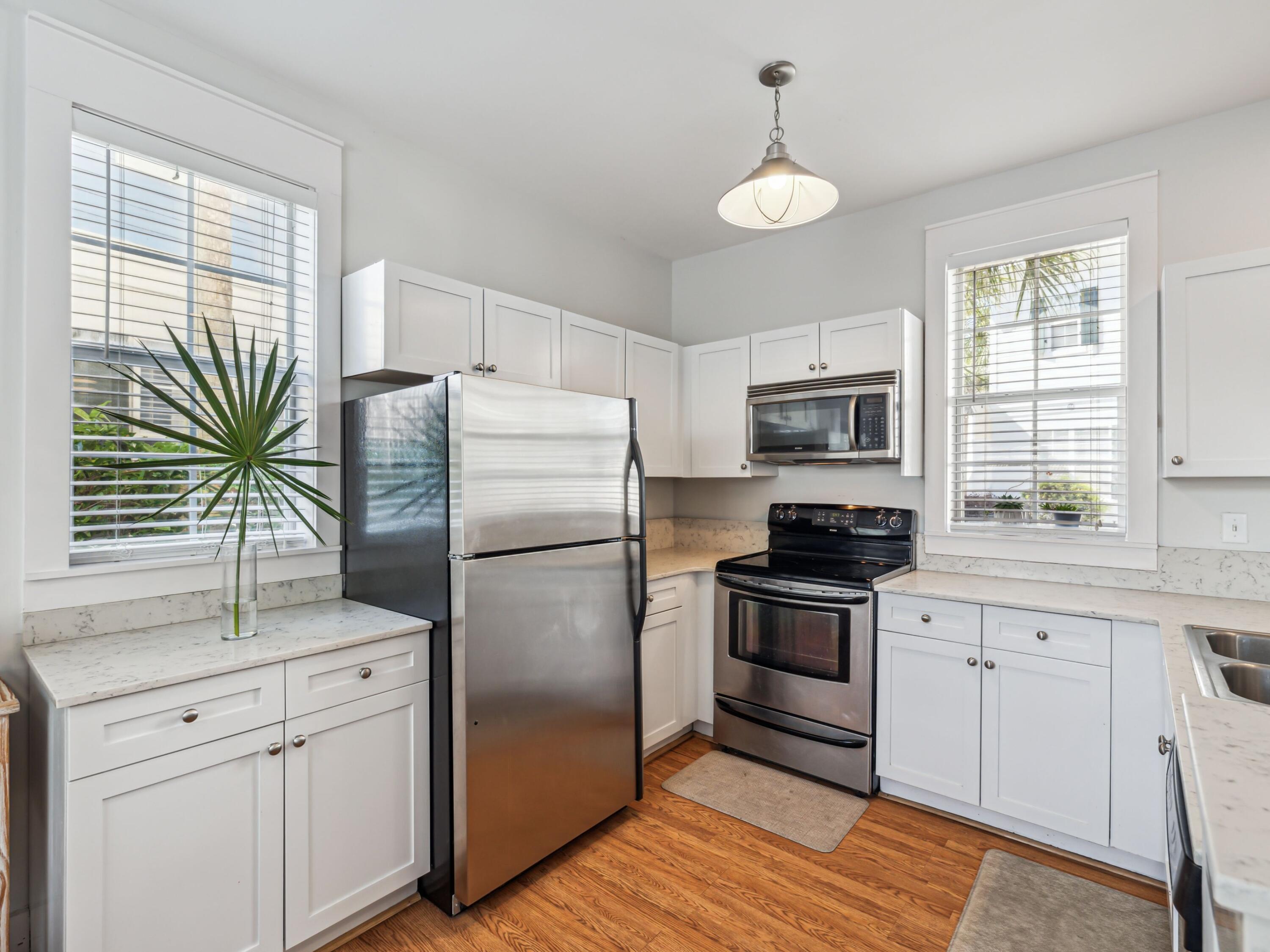 198 Somerset Bridge Road, Unit 103 Santa Rosa Beach, FL 32459 - Photo 13 of 39 a kitchen with a refrigerator stove and sink
