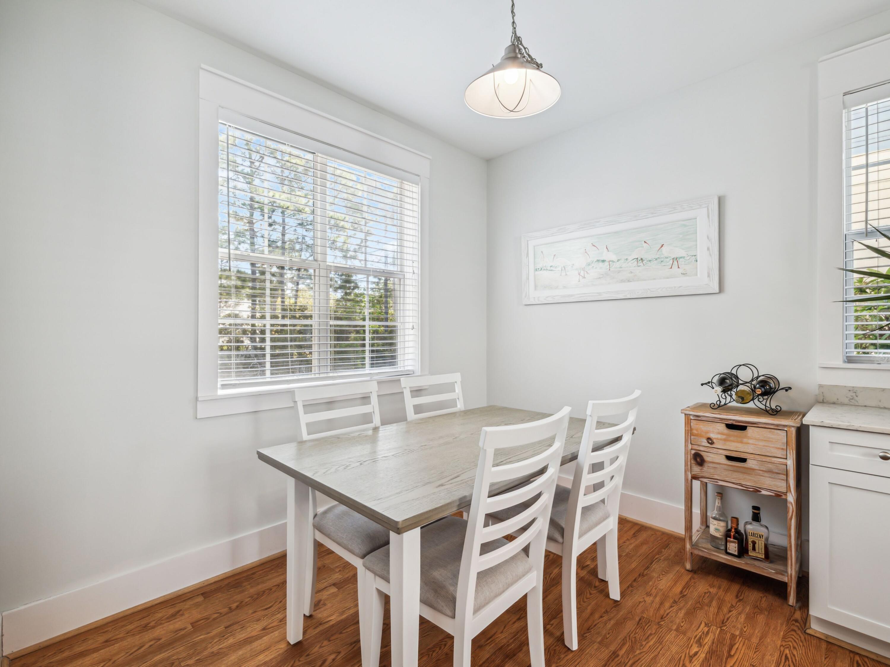 198 Somerset Bridge Road, Unit 103 Santa Rosa Beach, FL 32459 - Photo 16 of 39 a view of a dining room with furniture window and wooden floor