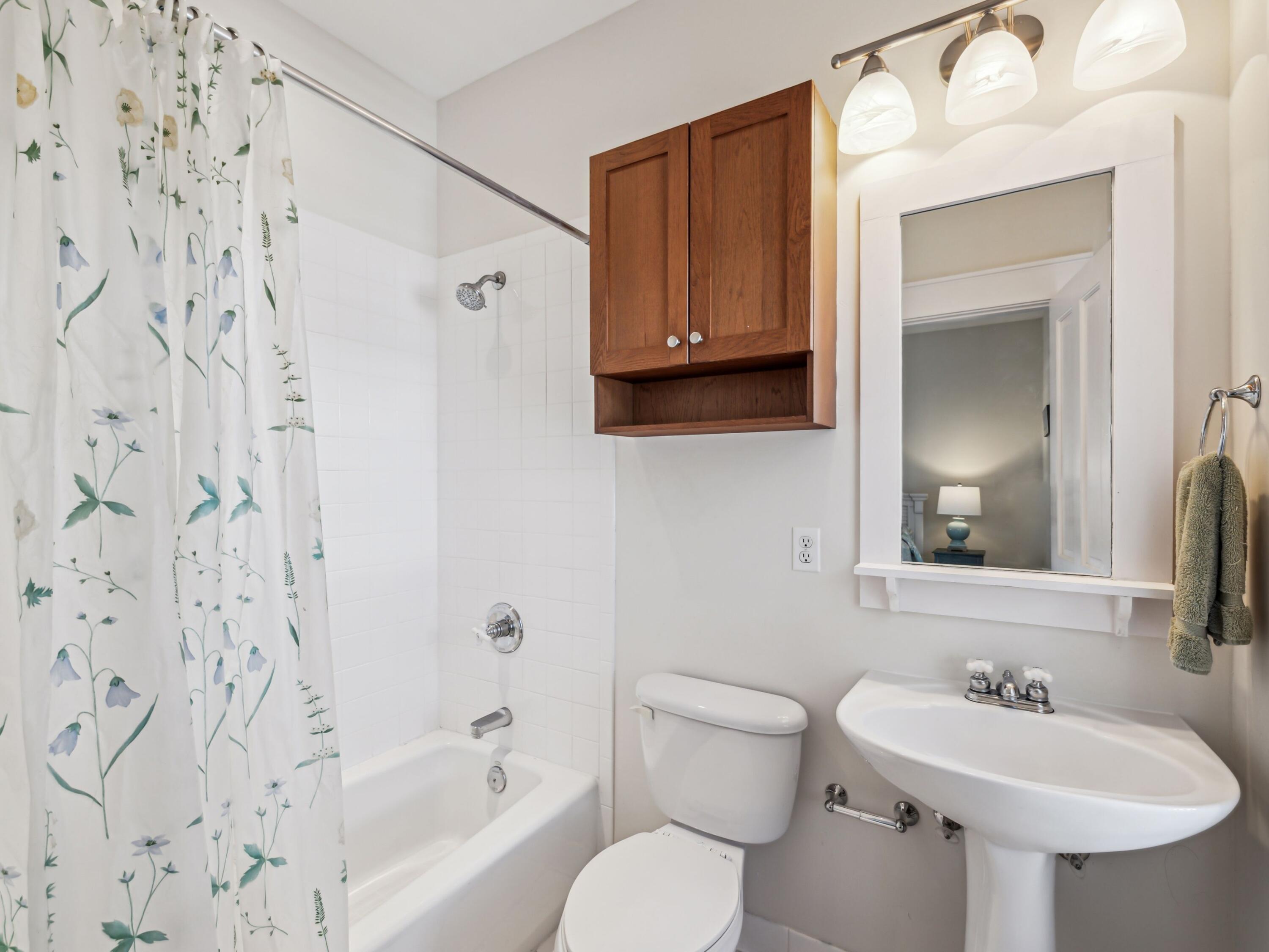 198 Somerset Bridge Road, Unit 103 Santa Rosa Beach, FL 32459 - Photo 24 of 39 a bathroom with a sink toilet and shower