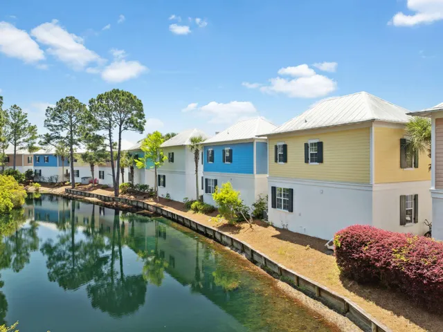 a view of a swimming pool and an outdoor seating