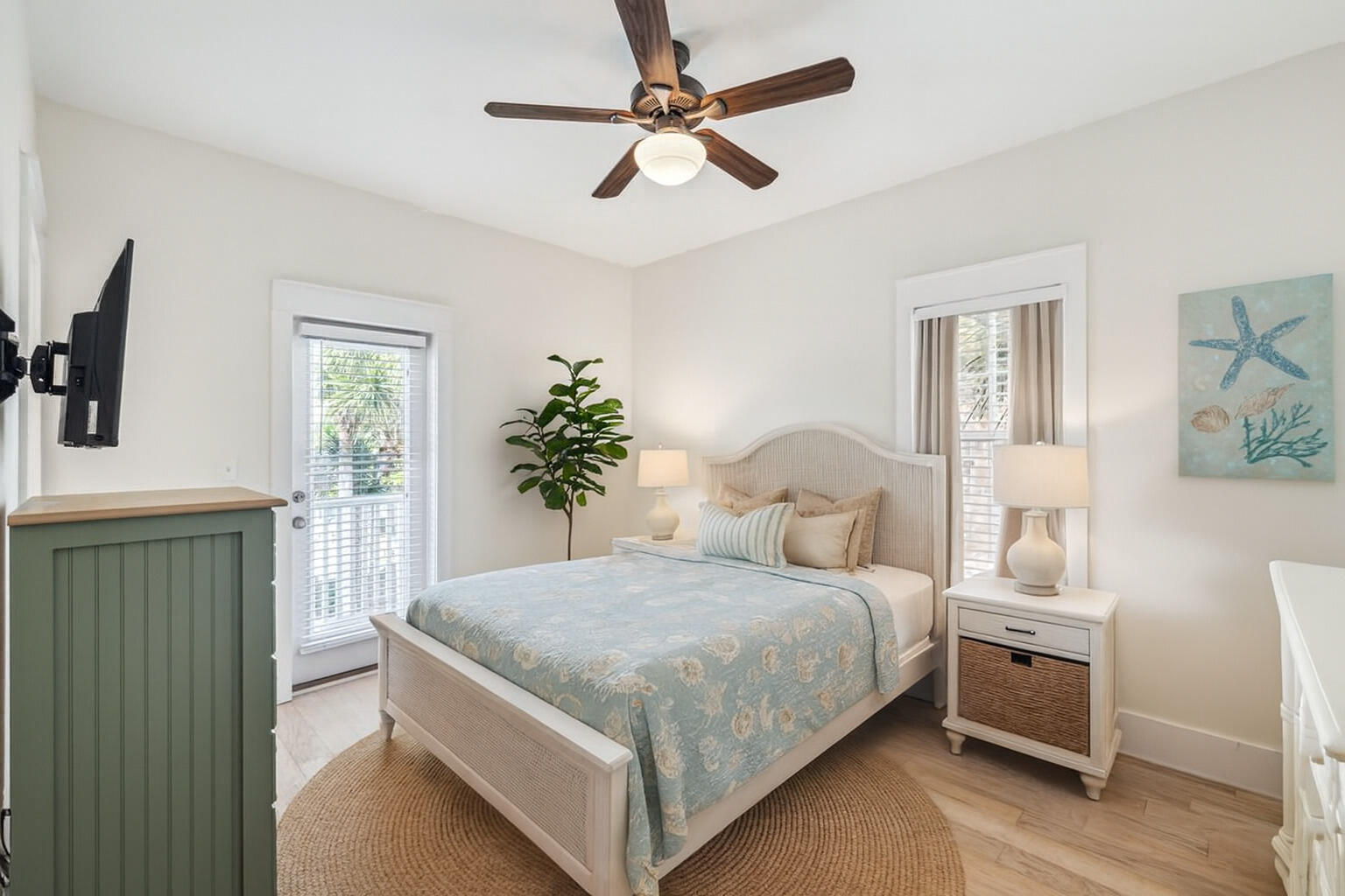 198 Somerset Bridge Road, Unit 103 Santa Rosa Beach, FL 32459 - Photo 6 of 39 a bedroom with a large bed and a chandelier fan